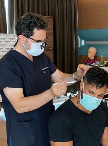 Ricky Whittle in his consultation with Dr. Acar marking the donor and transplant areas before the operation