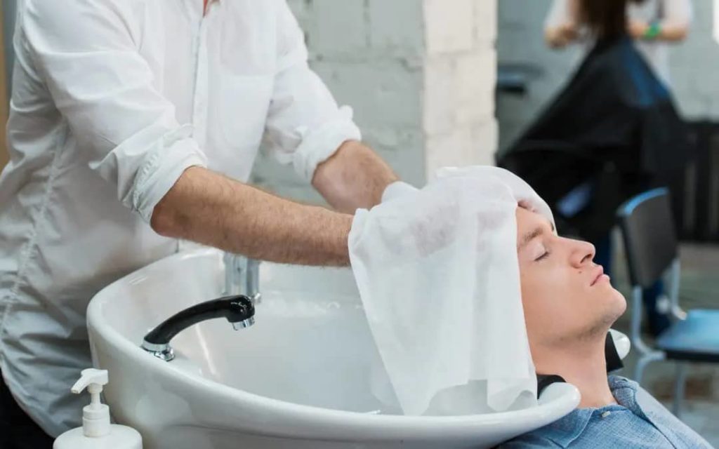 Man washing hair after hair transplant