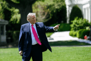 Picture of Donald Trump waving his hand in a direction