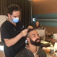 Photo of Canadian baseball player, Dalton Pompey, during his hair transplant consultation with Dr. Levent Acar at Cosmedica Clinic