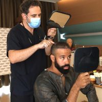 Image of Canadian baseball player, Dalton Pompey, during his hair transplant consultation with Dr. Levent Acar at Cosmedica Clinic