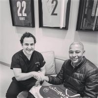 Brazilian football player Gilberto Silva with Dr Acar at Cosmedica Clinic for a hair transplant consultation