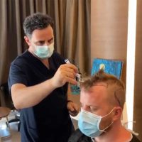 Actor Robert Kazinsky during his hair analysis with Dr. Levent Acar before his transplant in Turkey at Cosmedica Clinic