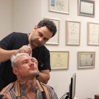 Thomas Powell during his hair analysis consultation with Dr. Levent Acar at Cosmedica Clinic